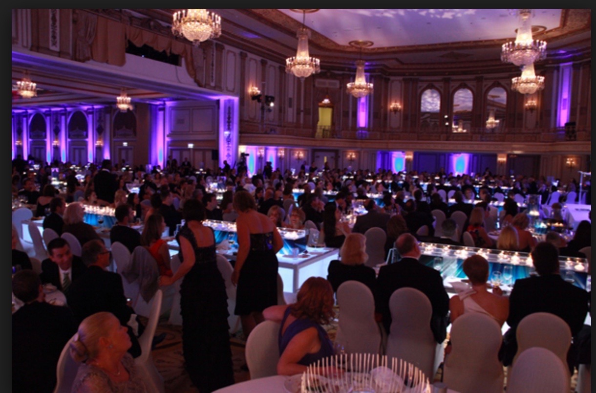 Sophisticated corporate gala with elegant table arrangements