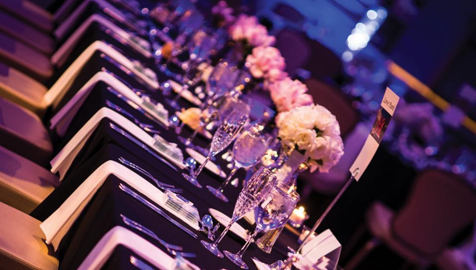 Sophisticated corporate gala with elegant table arrangements