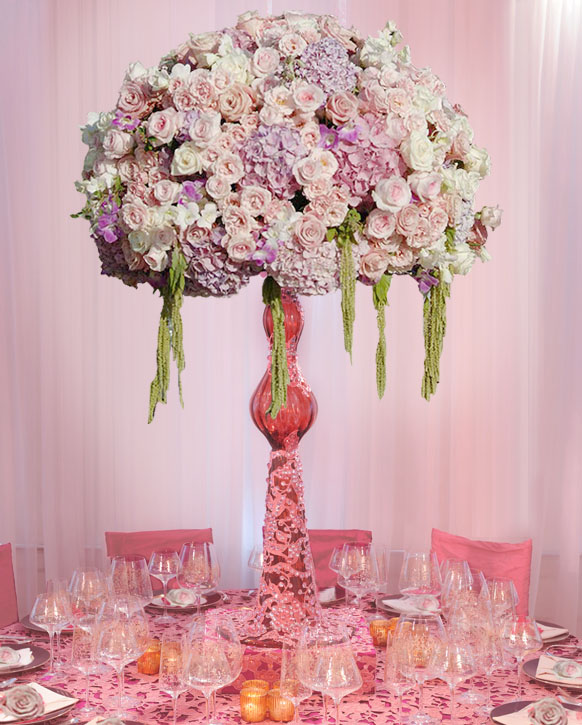 Tall floral centerpieces on a luxury reception table