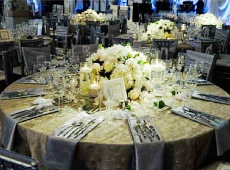 Detail of an elegant event tablescape being styled